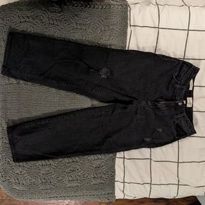 Black lightly distressed curvy vintage straight jeans. Size 10/30R
